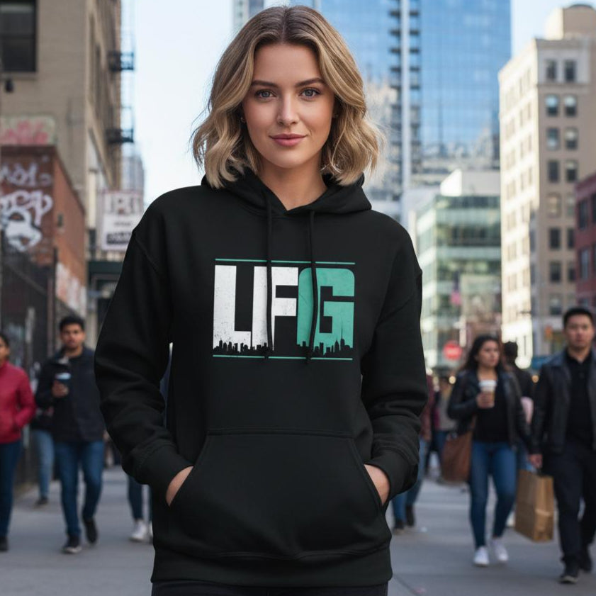 Woman wearing a black hoodie with 'LFG' logo on a city street