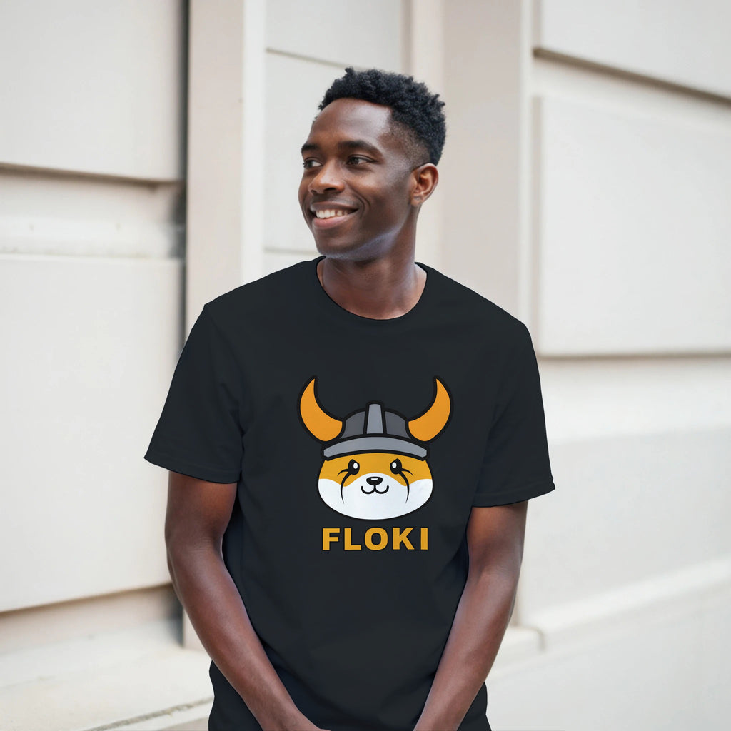 Person wearing a black t-shirt with a graphic design and text, standing outdoors.