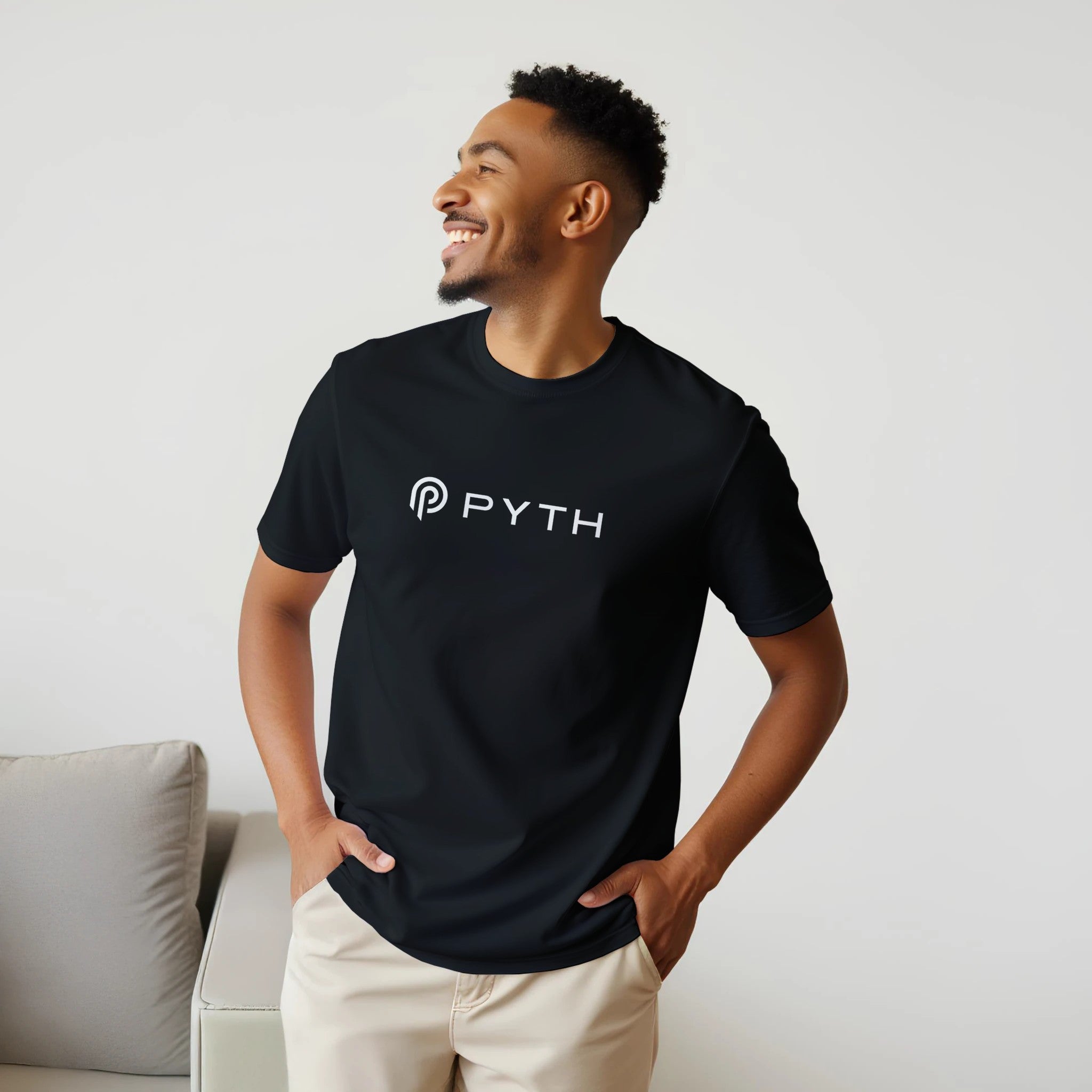 Man wearing a black t-shirt with 'PYTH' logo against a light background