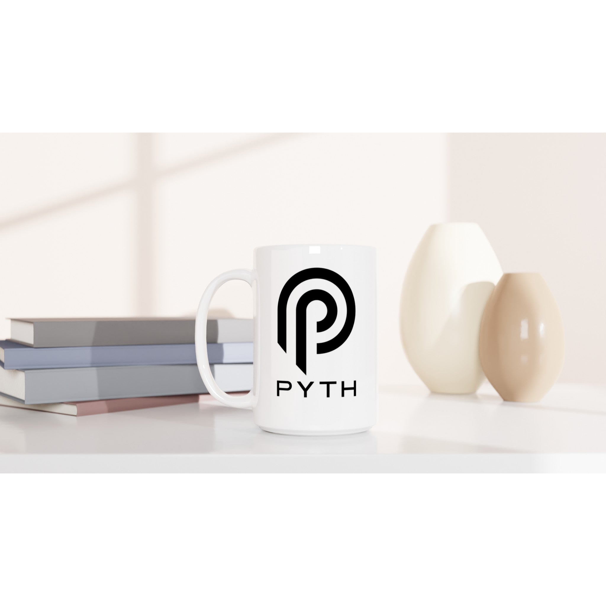 White mug with 'PYTH' logo on a white surface with books and decorative items.