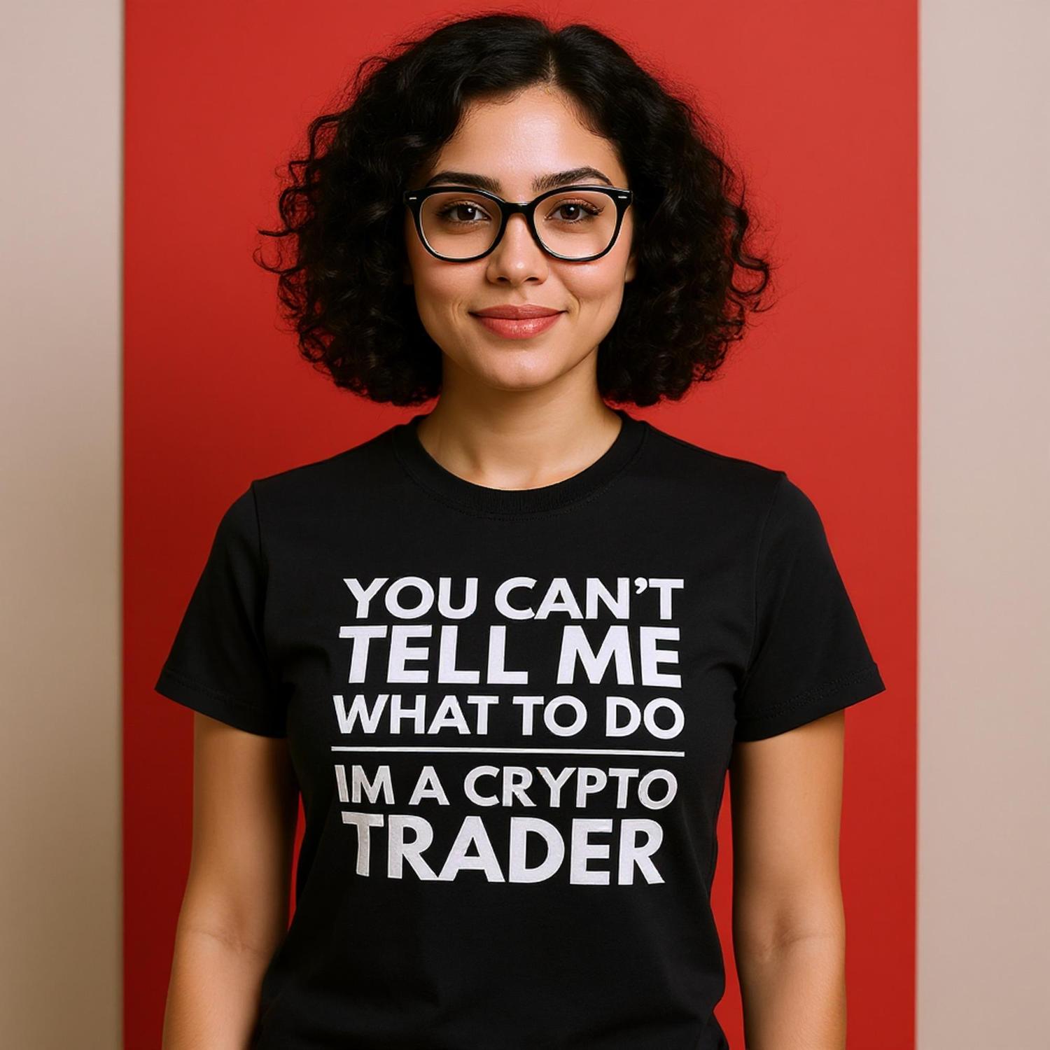 Person wearing a black t-shirt with a crypto trader message on a red background