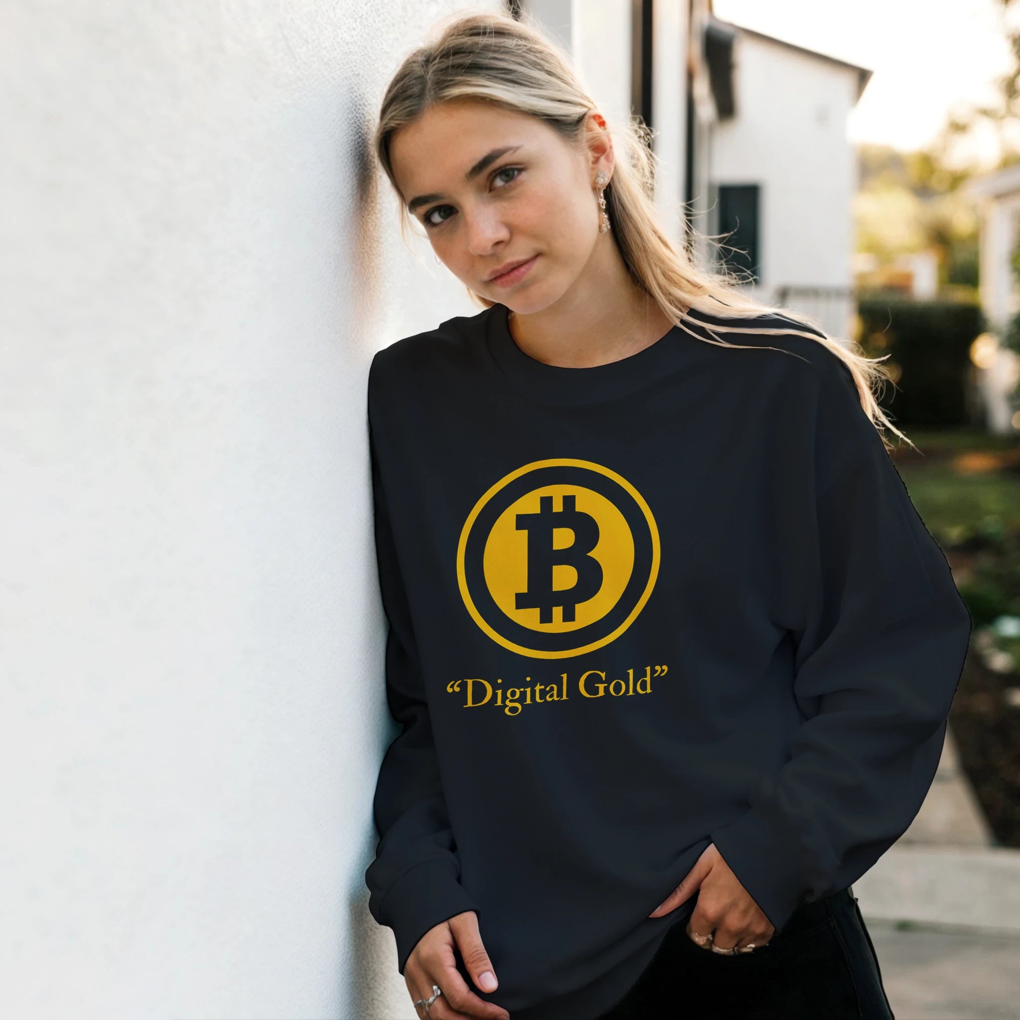 Person wearing a black sweatshirt with Bitcoin symbol and 'Digital Gold' text.