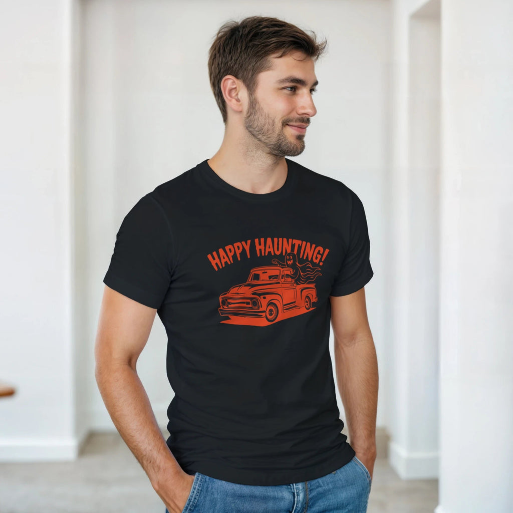 Man wearing a black t-shirt with 'Happy Haunting!' and a haunted house graphic.