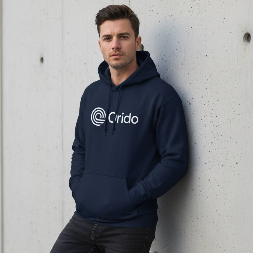 Man wearing a navy hoodie with 'Orido' logo against a concrete wall