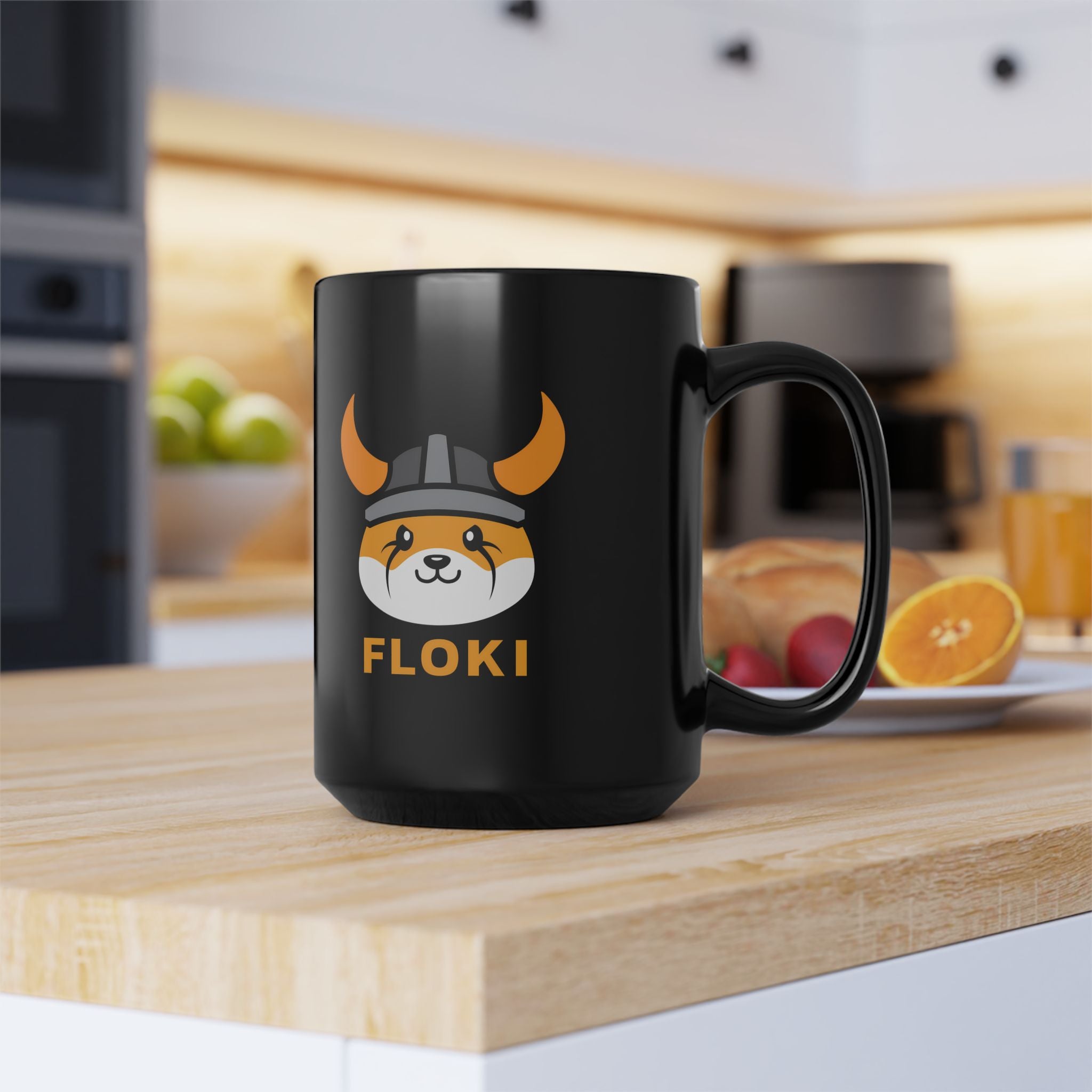 Black mug with a dog graphic and 'FLOKI' text on a kitchen counter.