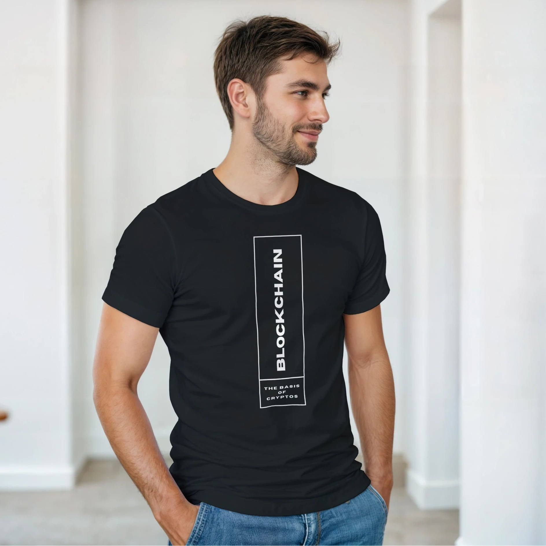 Man wearing a black t-shirt with 'Blockchain' text in a minimal indoor setting