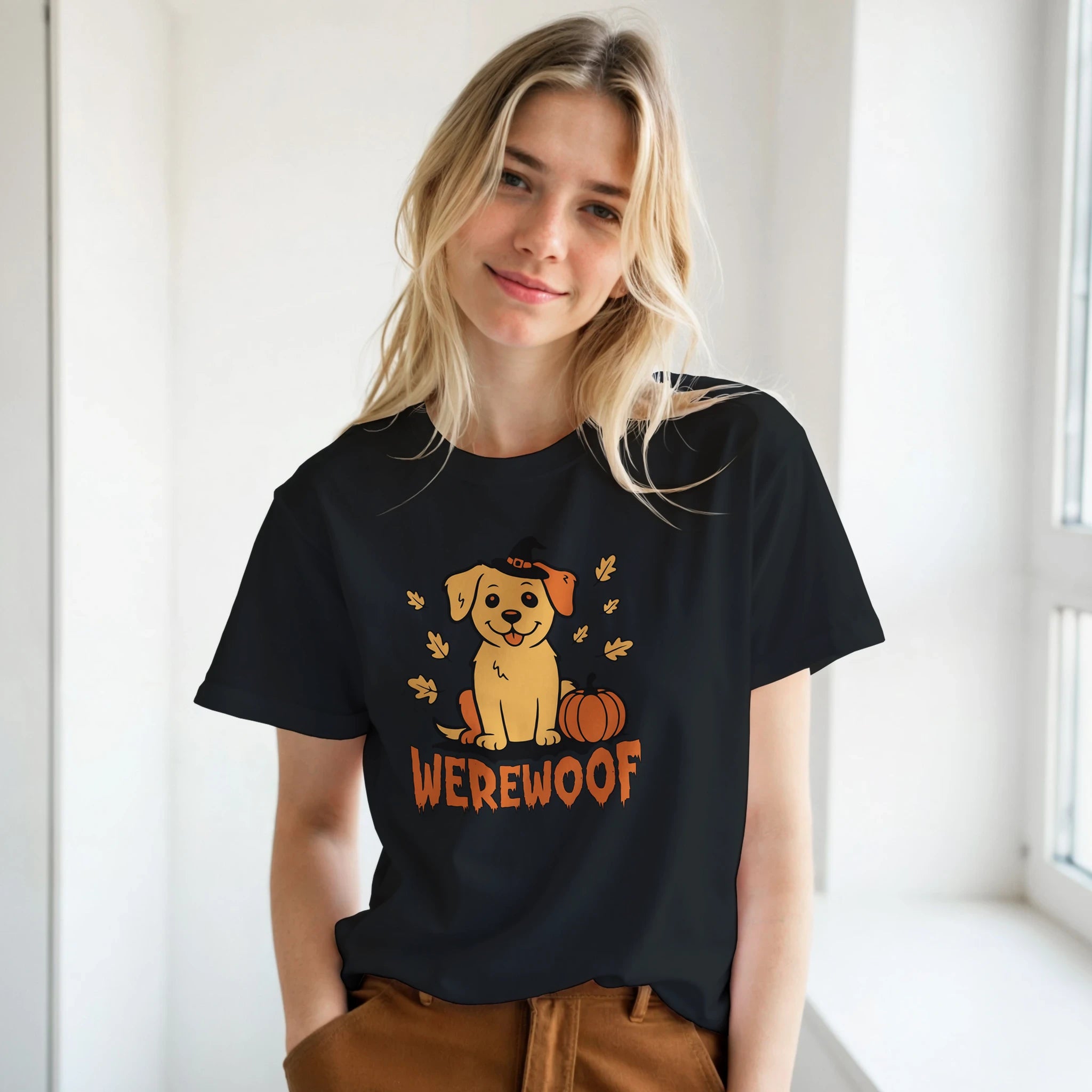 Woman wearing a black t-shirt with a dog graphic and 'WEREWOLF' text in a room with a window.