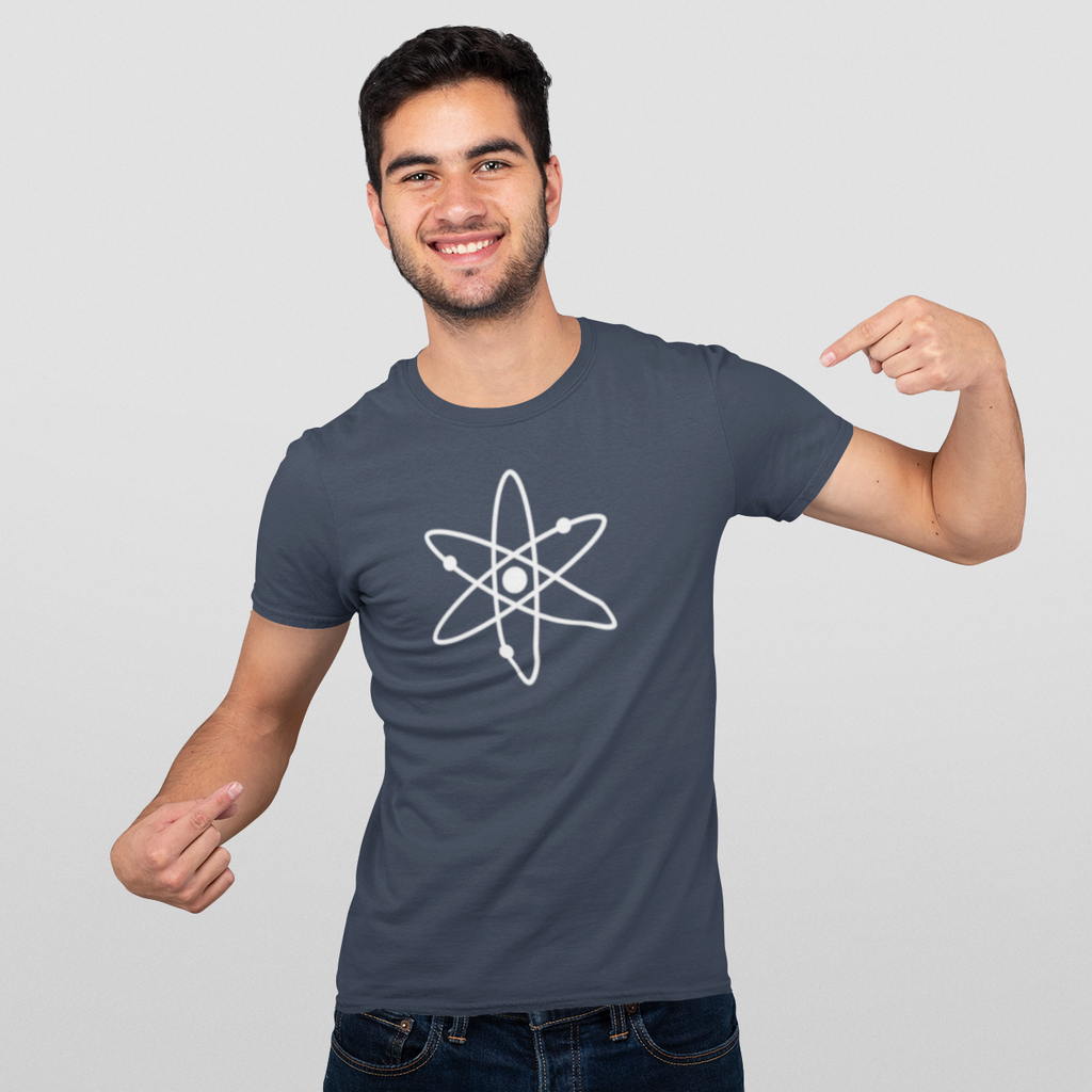 Man wearing a t-shirt with an atom symbol on a plain background