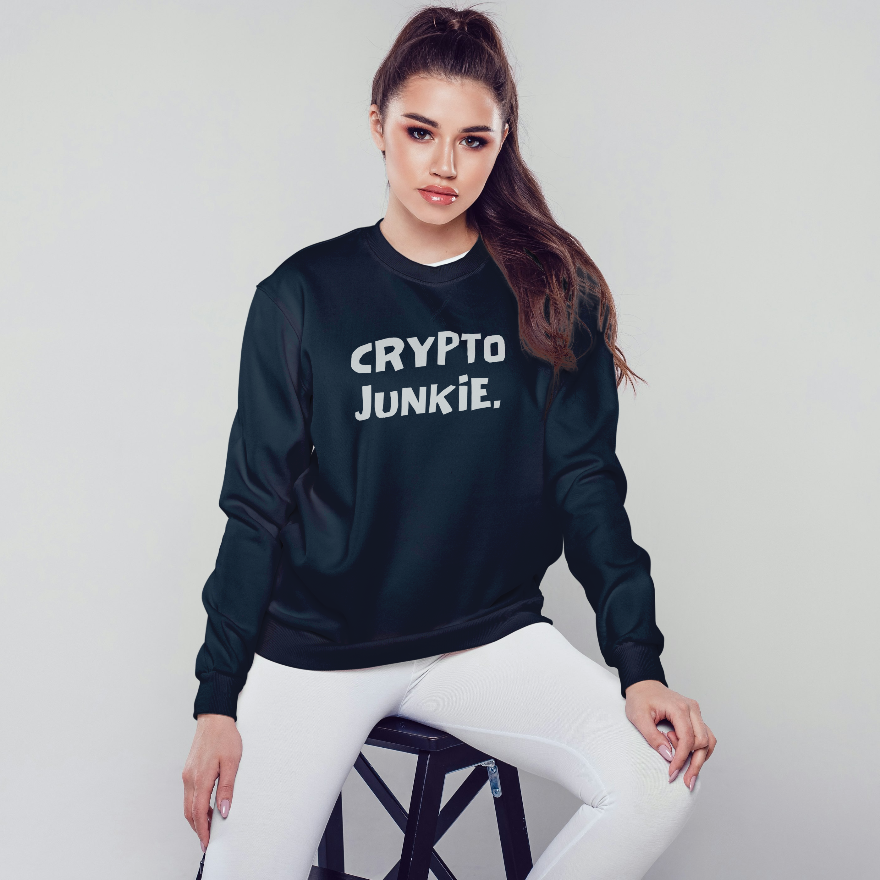 Person wearing a black sweatshirt with 'CRYPTO JUNKIE' text on a white background