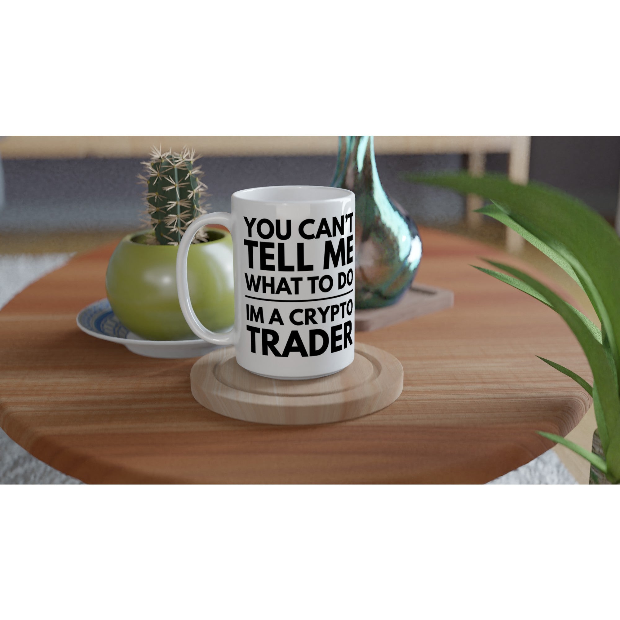 White mug with text on a wooden table with decorative items