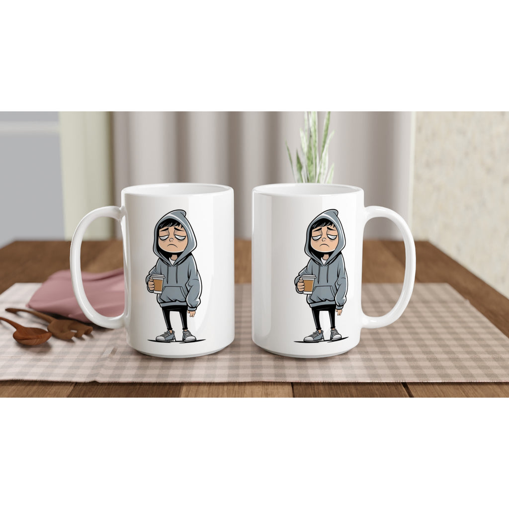 Two white mugs with cartoon character design on a wooden table.