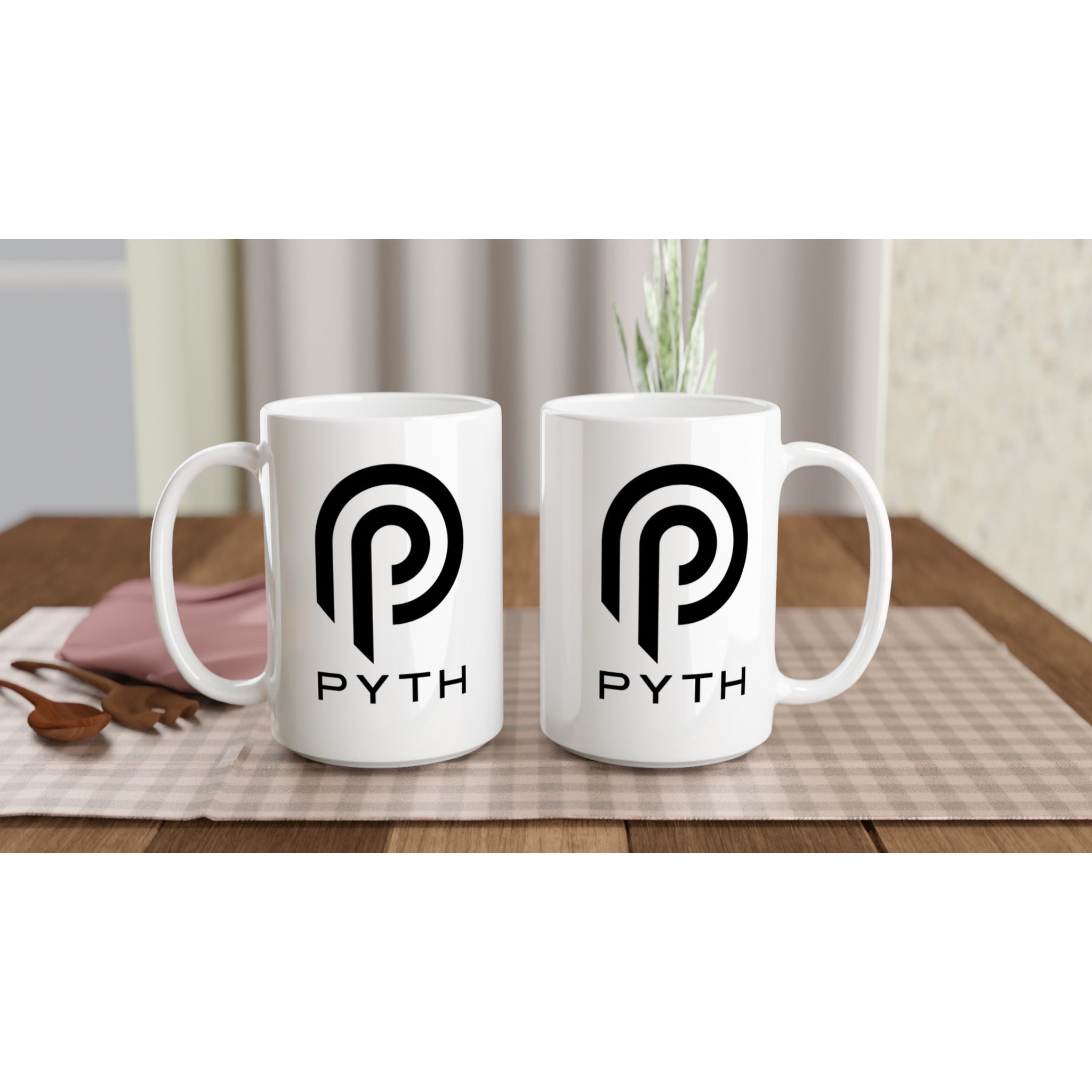 Two white mugs with a logo and 'PYTH' text on a wooden table.