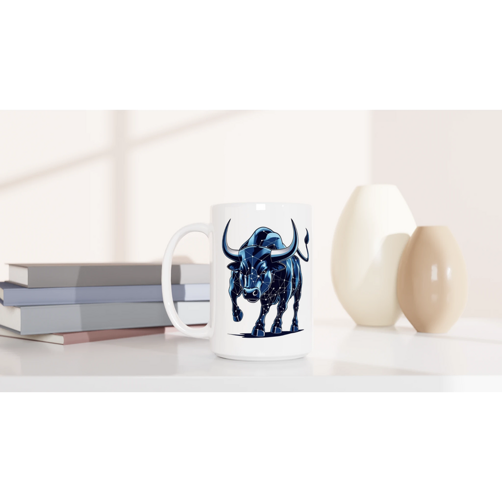 Mug with a blue bull design on a white surface with books and decorative items.