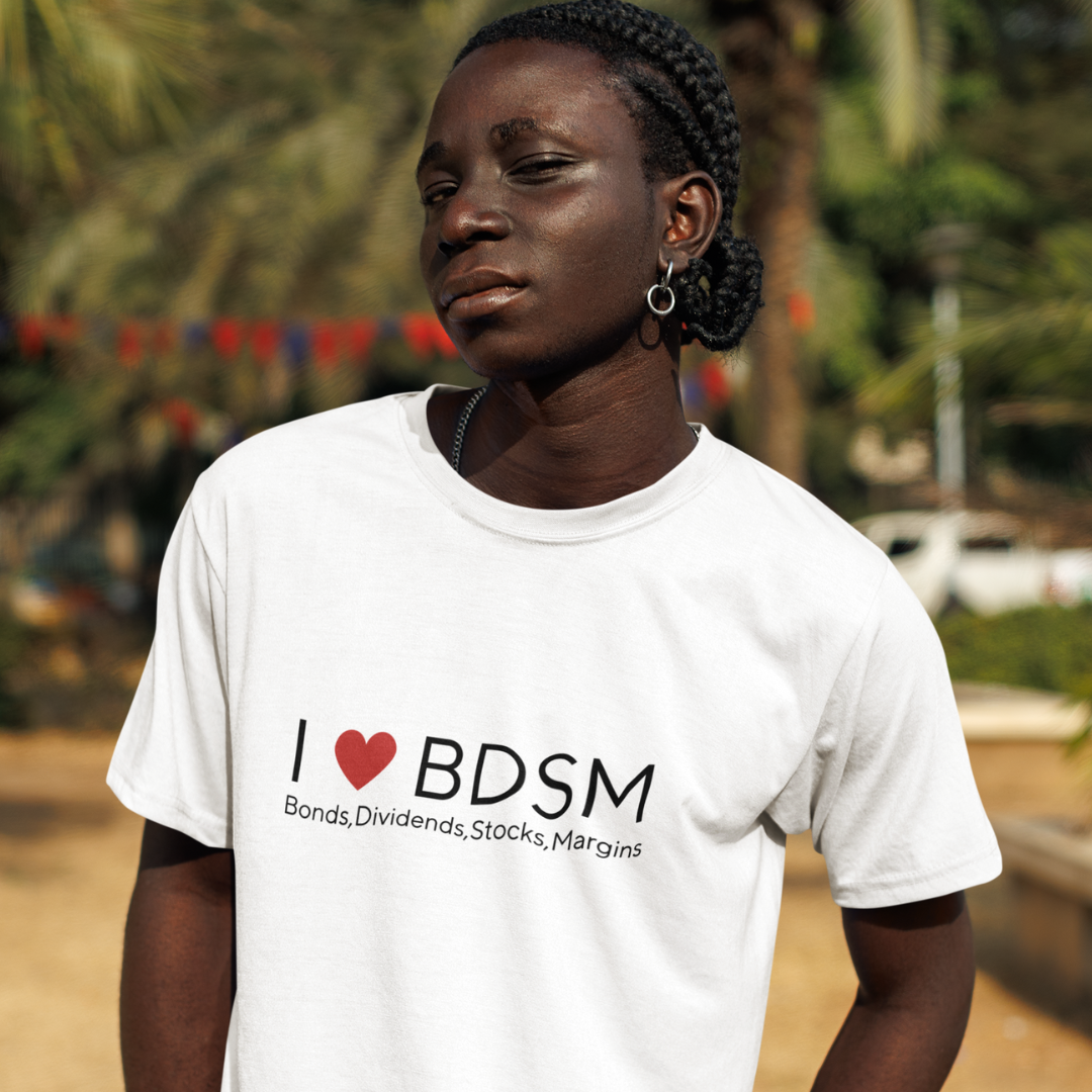 Person wearing a white t-shirt with 'I ❤️ BDSM' text, standing outdoors.