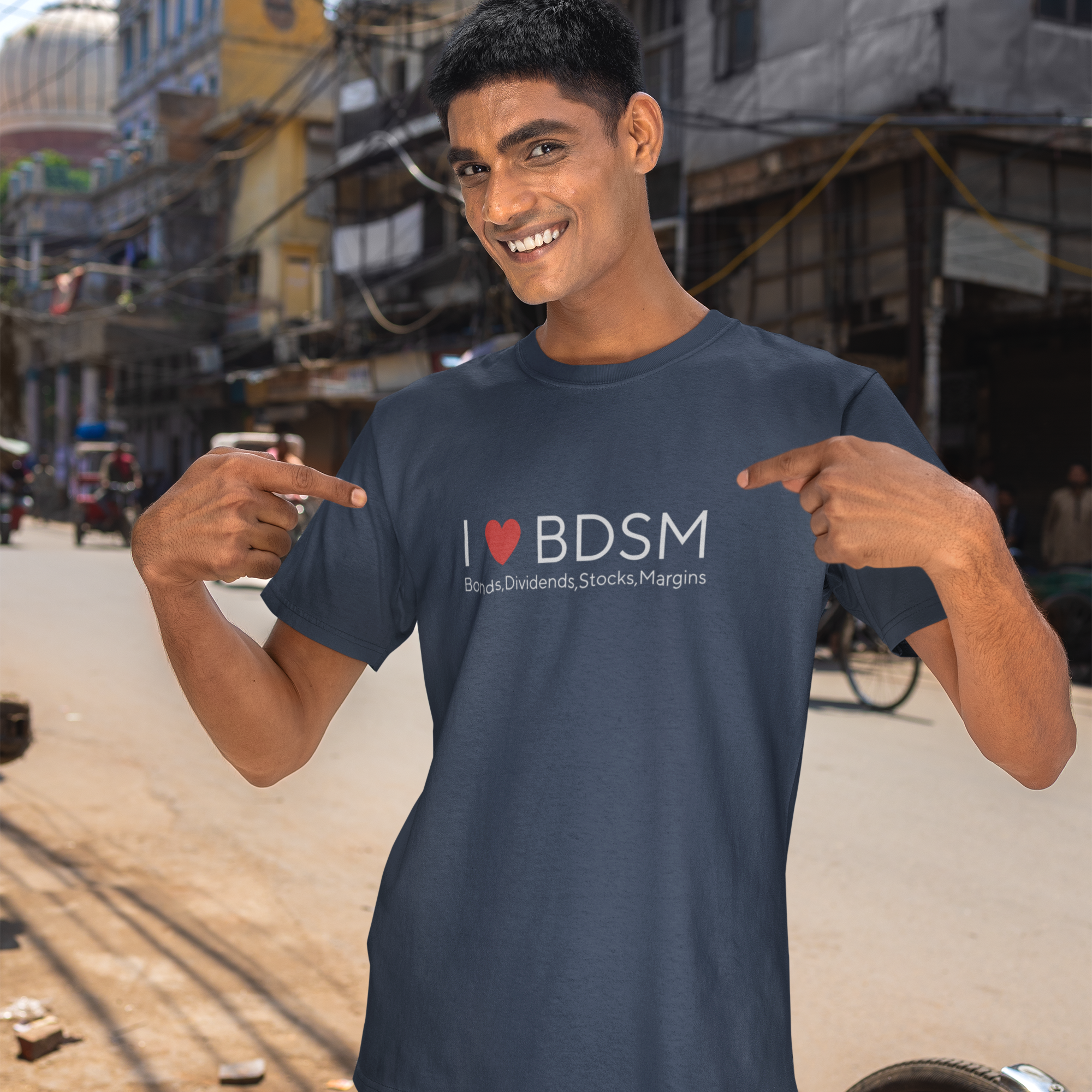 Man wearing a navy blue t-shirt with 'I ❤️ BDSM' text, standing on a street.