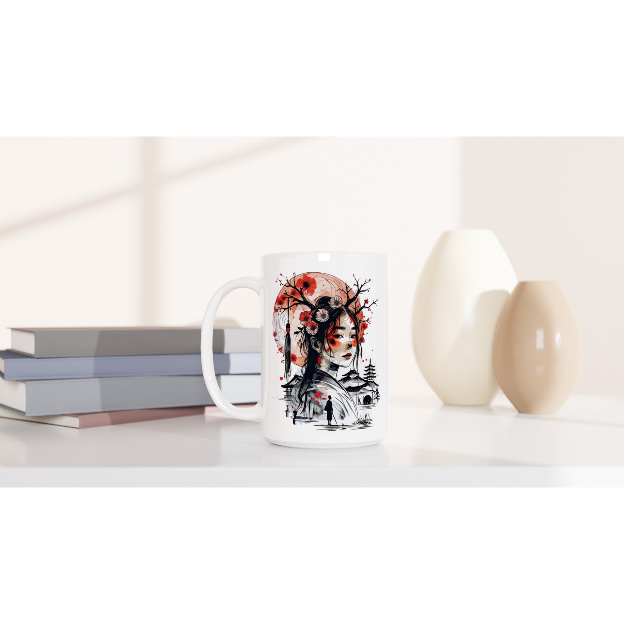 White mug with a decorative design on a white surface with books and decorative items.