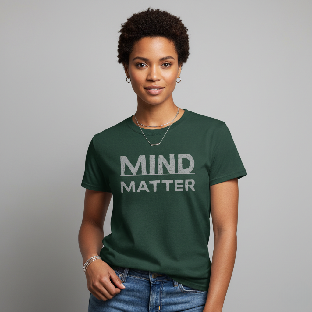 Person wearing a green t-shirt with 'MIND MATTER' text on a gray background