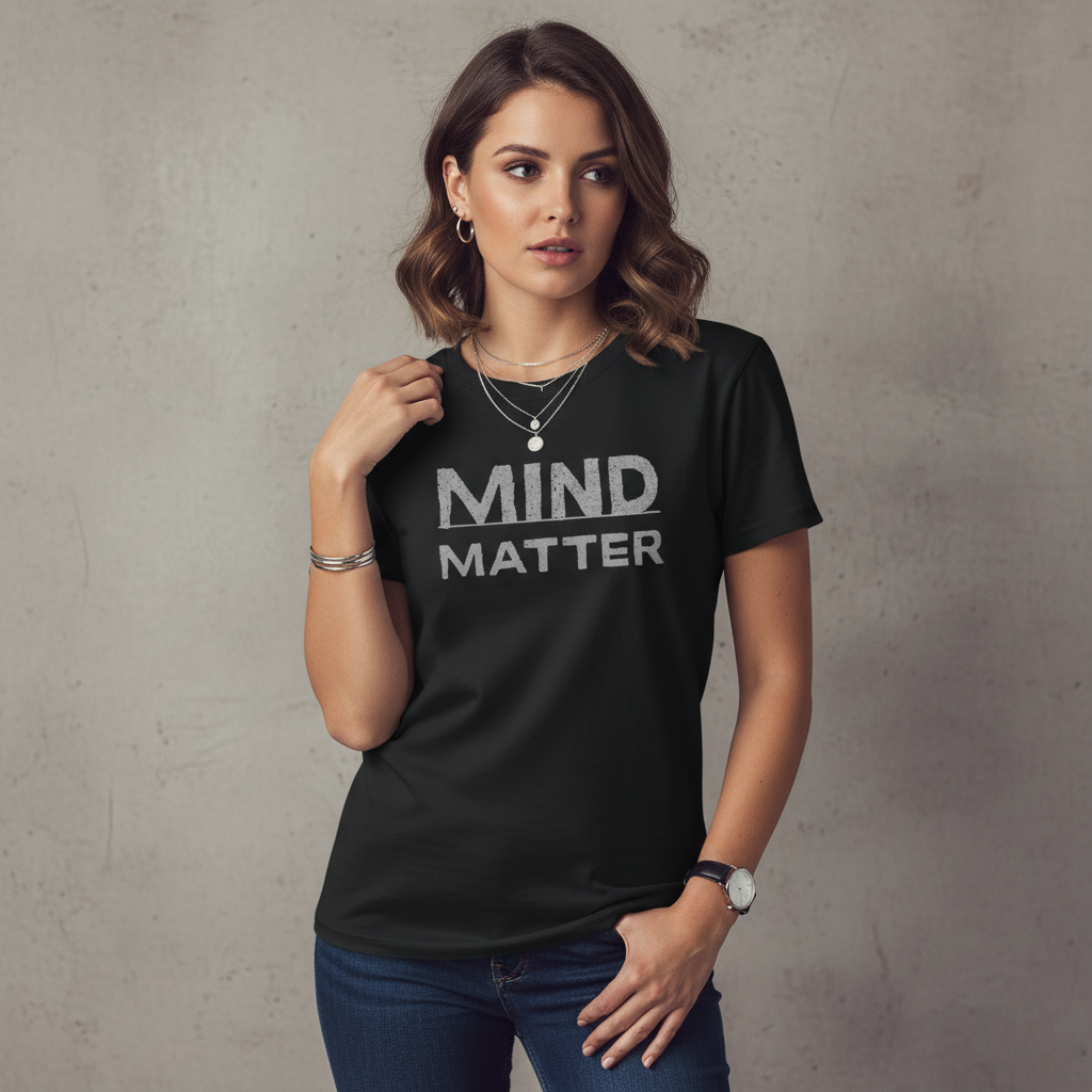Woman wearing a black t-shirt with 'MIND MATTER' text against a gray background