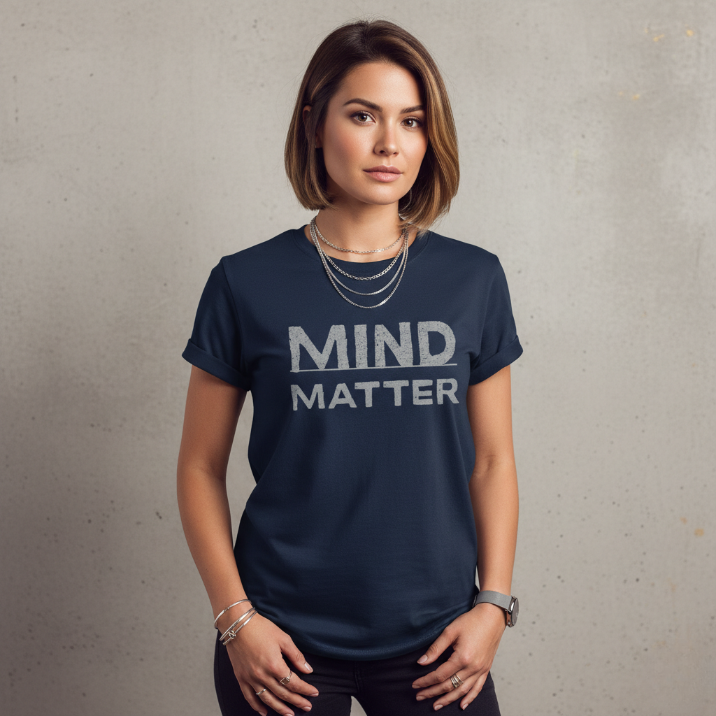 Woman wearing a navy blue t-shirt with 'MIND MATTER' text on a plain background