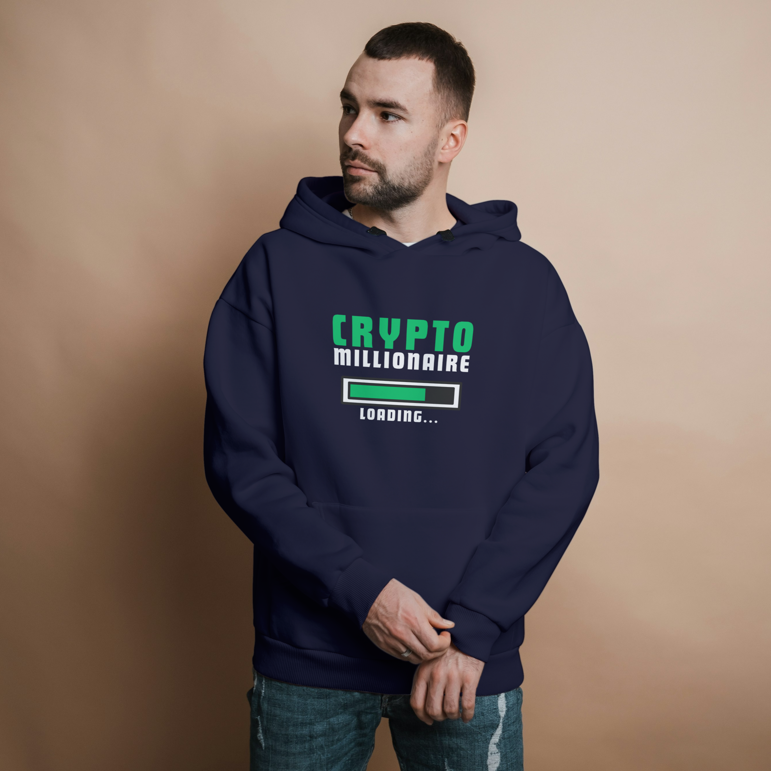 Man wearing a hoodie with 'Crypto Millionaire Loading...' text on a beige background