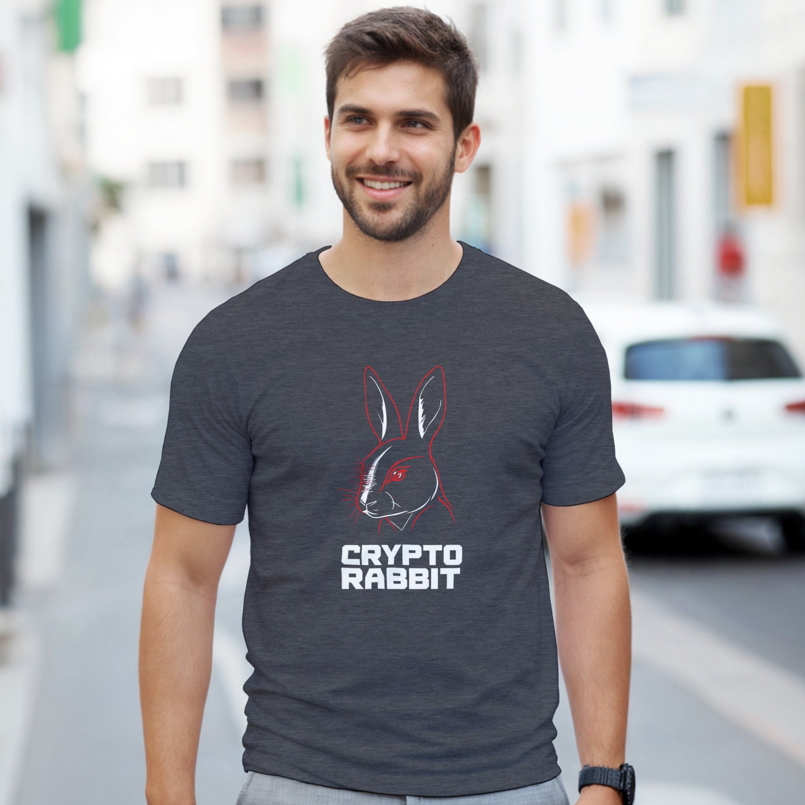 Man wearing a dark gray t-shirt with 'Crypto Rabbit' design on a city street.