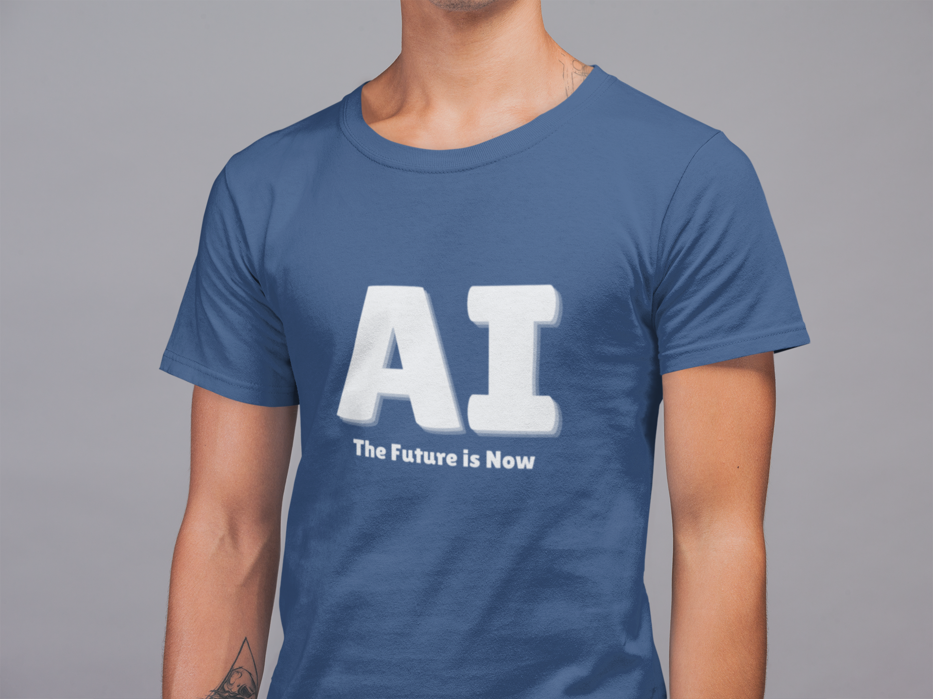 Person wearing a blue t-shirt with 'AI The Future is Now' text on a gray background