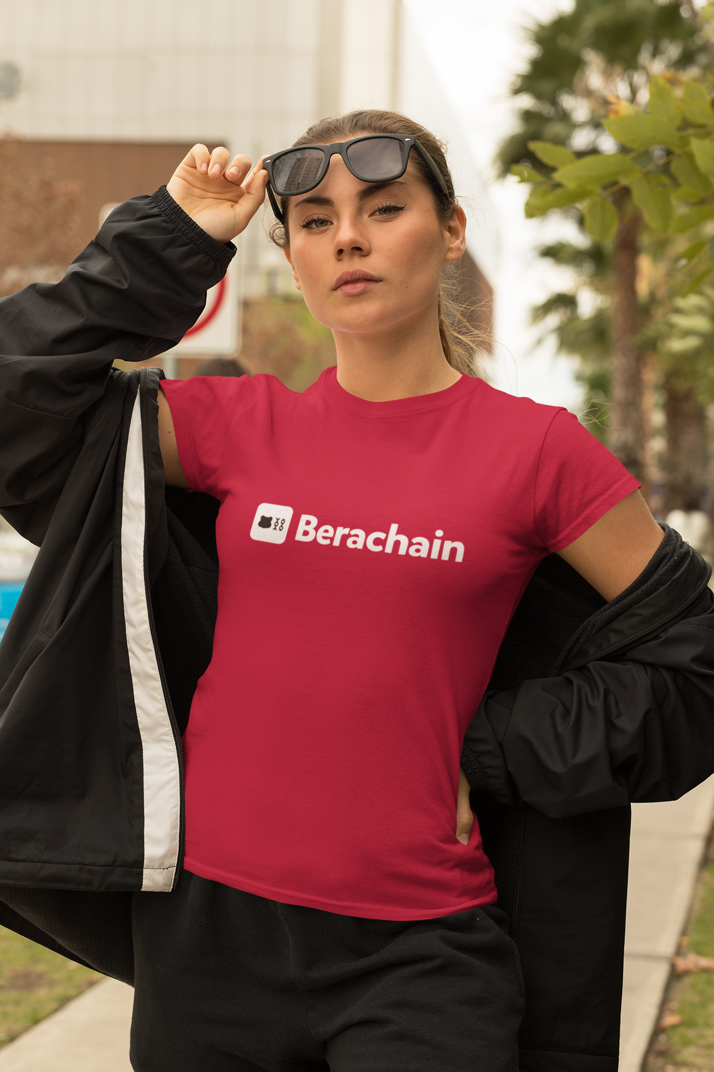 Person wearing a red Berachain t-shirt outdoors
