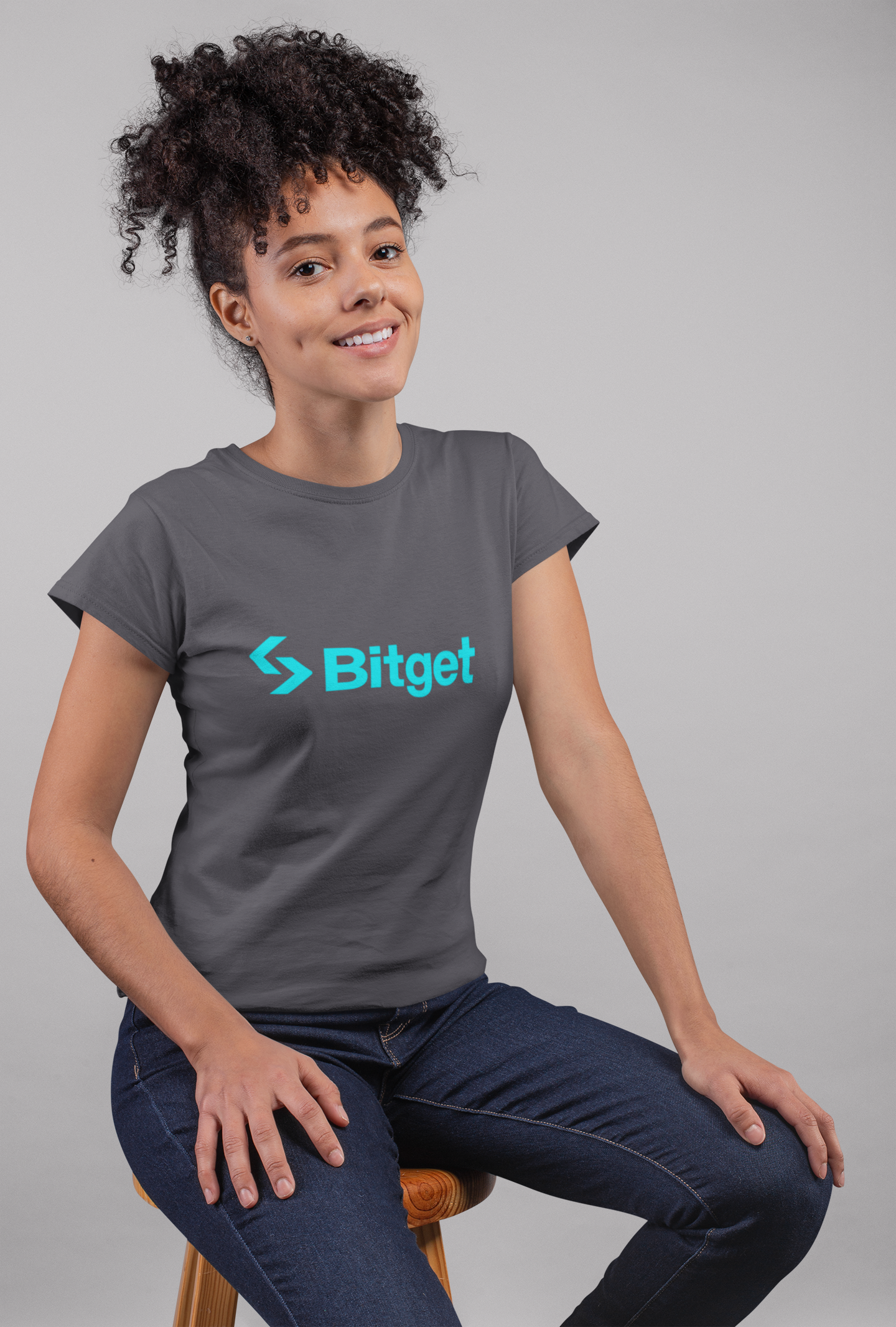 Person wearing a gray t-shirt with Bitget logo on a gray background