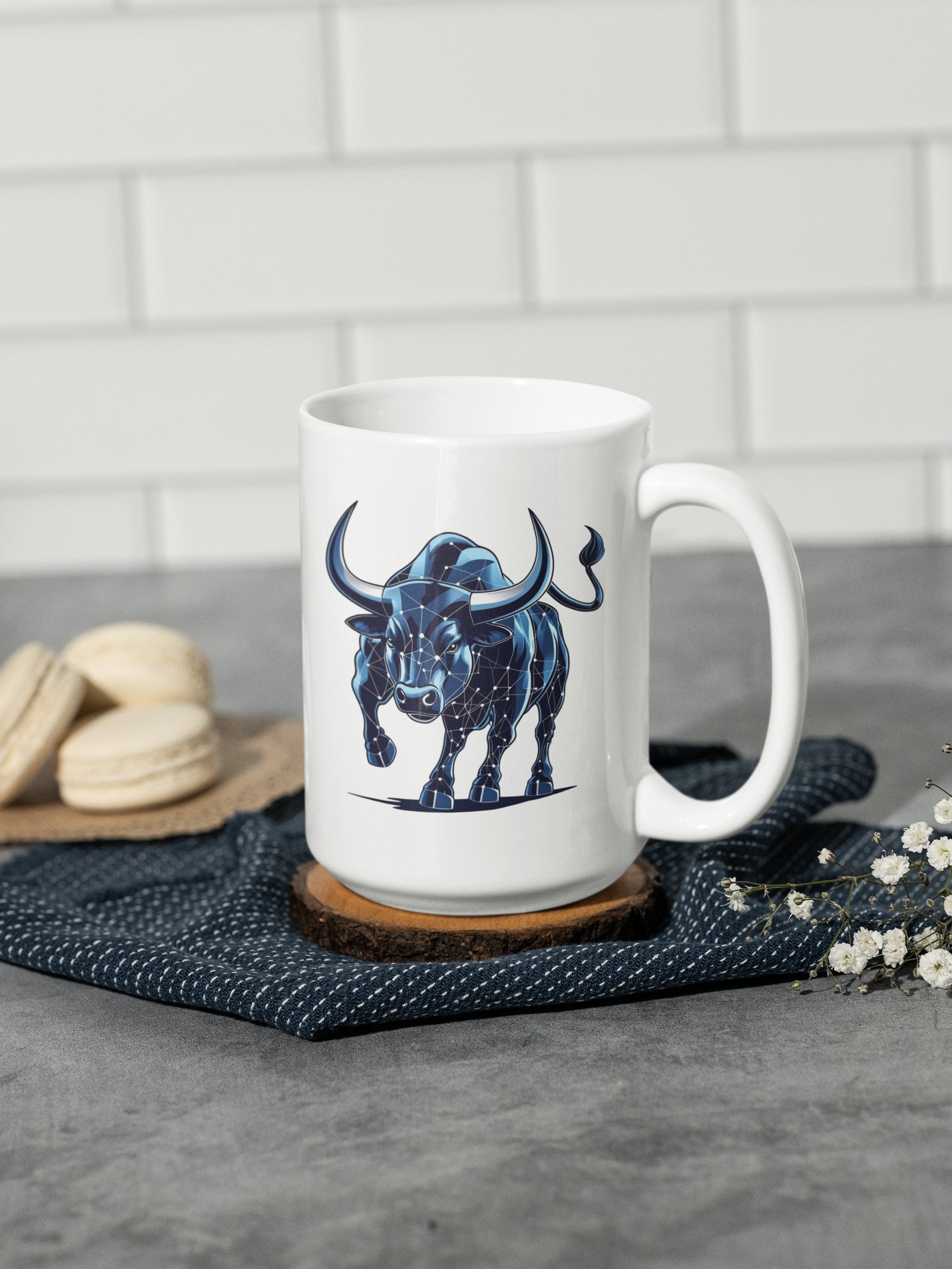 White mug with a blue bull design on a gray surface with a white tiled wall background