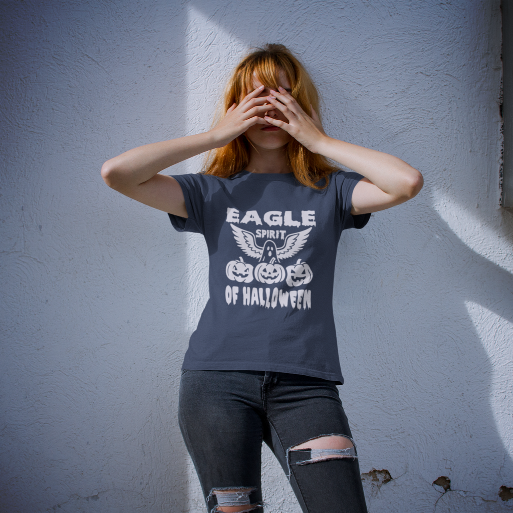 Person wearing a t-shirt with Halloween design against a white wall