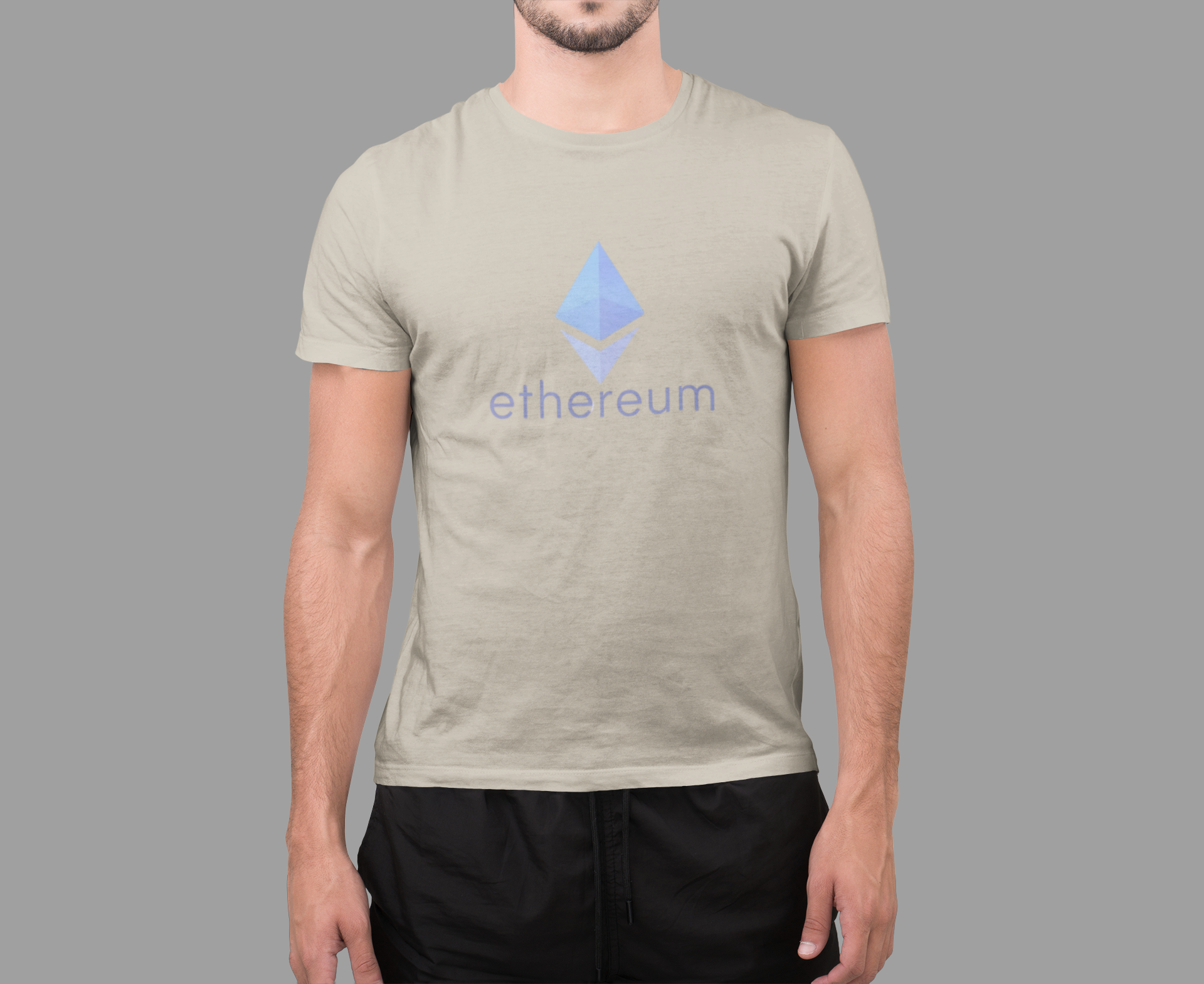 Person wearing a t-shirt with Ethereum logo and text on a gray background