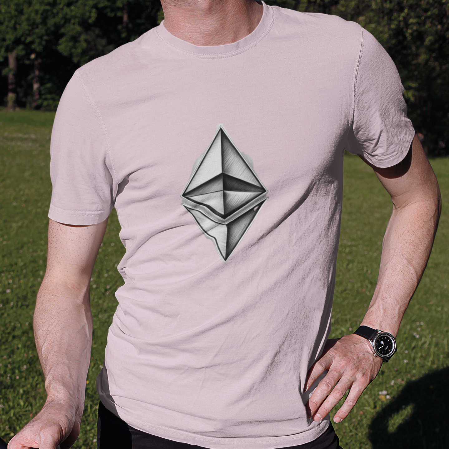 Person wearing a t-shirt with a geometric design outdoors