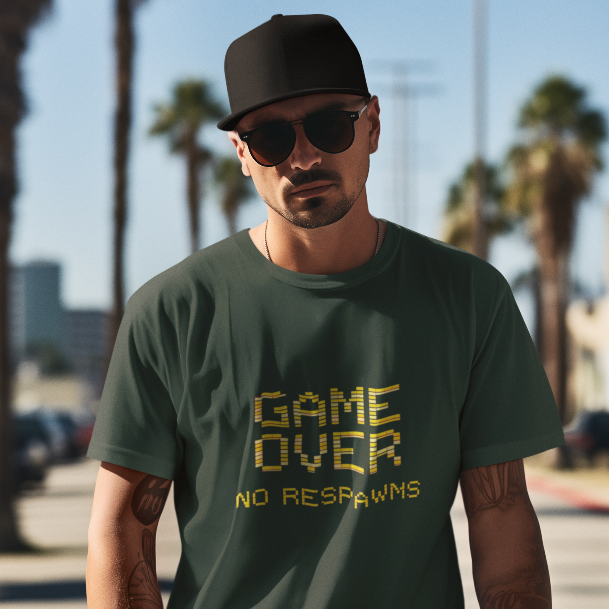 Man wearing a green t-shirt with 'Game Over No Respins' text, sunglasses, and a black cap in an outdoor setting with palm trees.