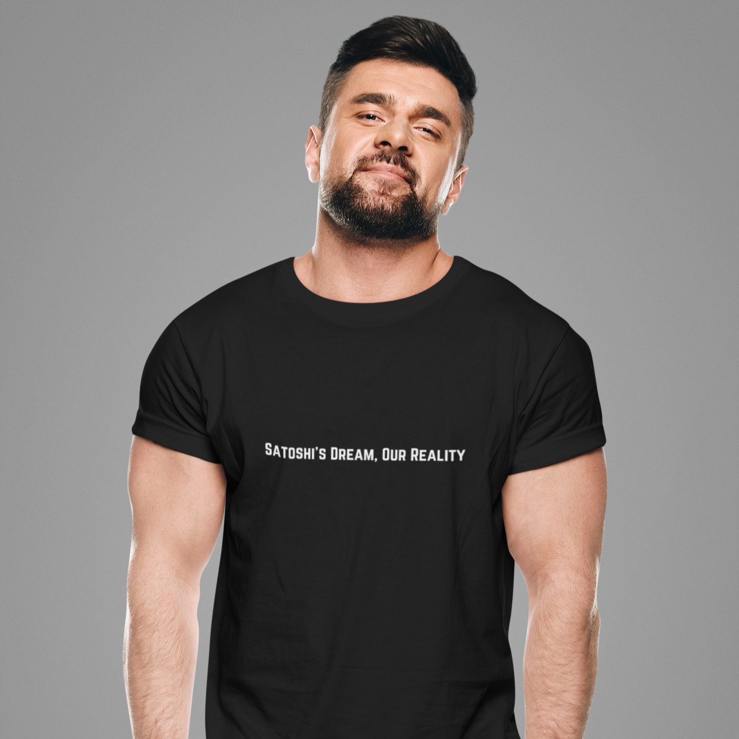 Man wearing a black t-shirt with text on a gray background