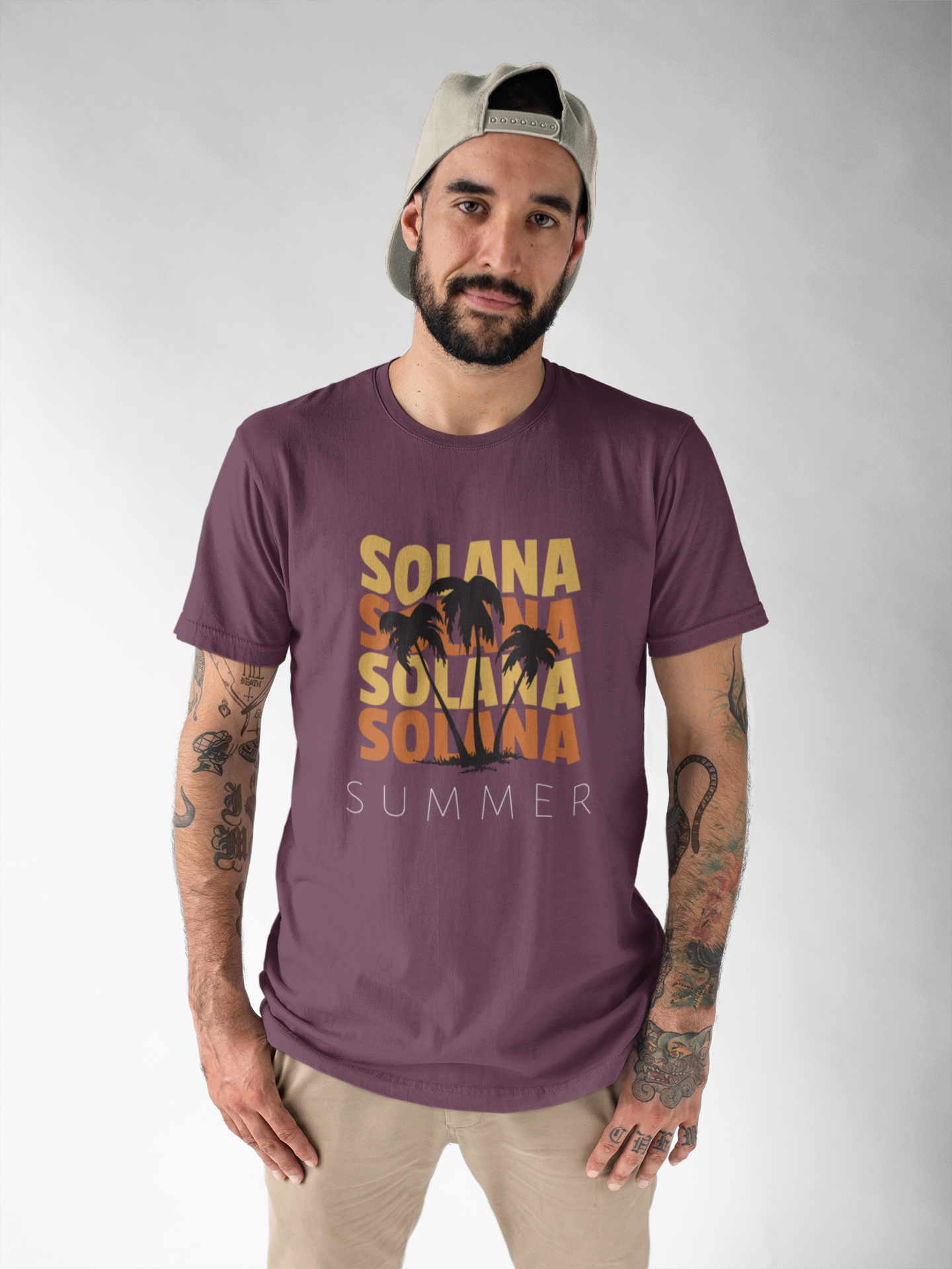 Man wearing a purple t-shirt with 'Solana Summer' text and graphic on a gray background