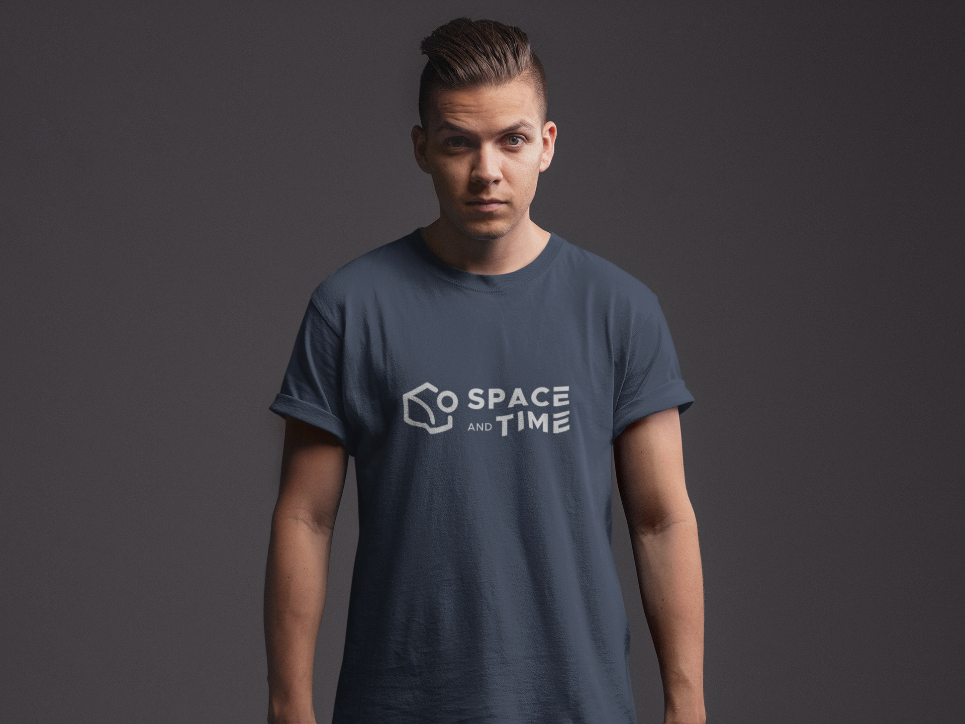 Person wearing a blue t-shirt with 'Space and Time' logo on a dark background