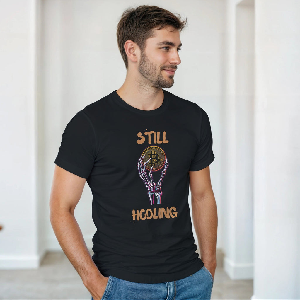 Man wearing a black t-shirt with a graphic design and text in a room.