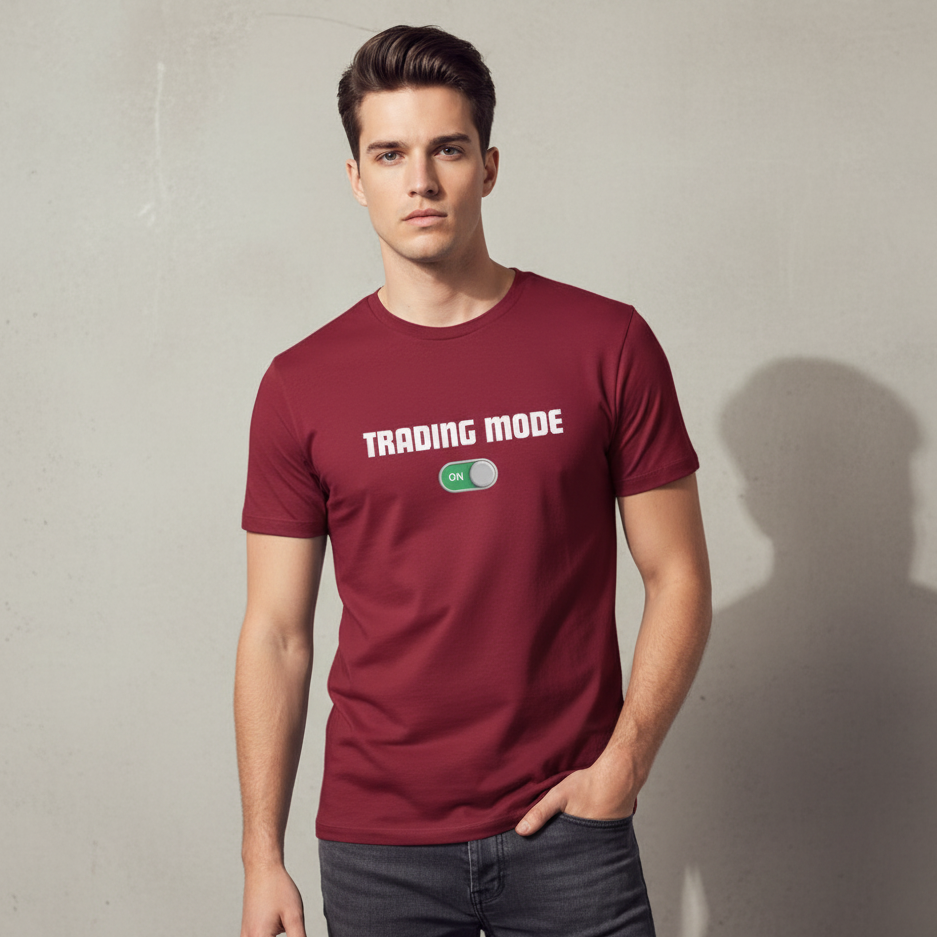 Man wearing a maroon t-shirt with 'TRADING MODE' text on a plain background